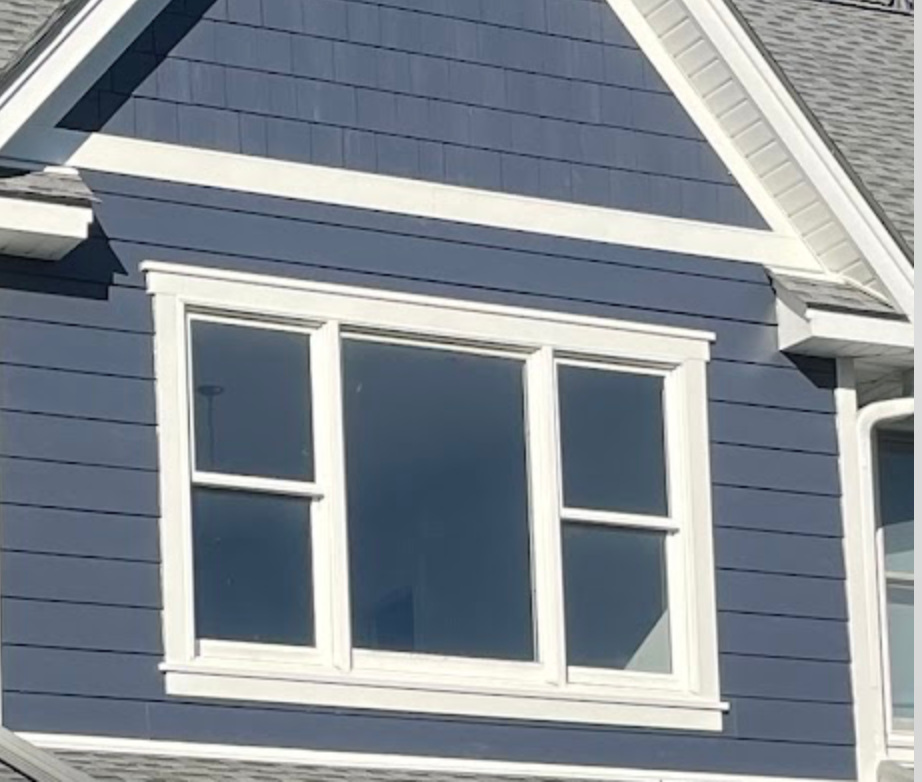 Vinyl shake siding with white trim on a Ridgewood NJ home