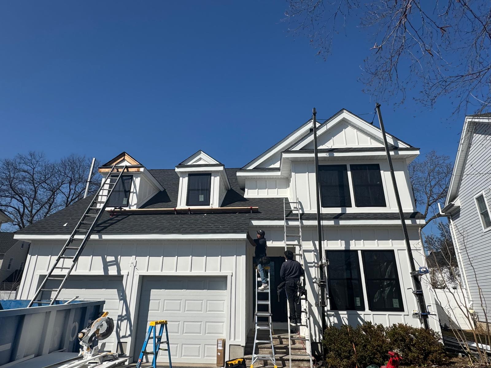 James Hardie board and batten siding installation with PVC trim and scaffolding, Essex County NJ